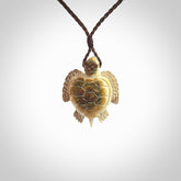 This is a beautiful hand carved woolly mammoth tusk turtle pendant. A really cool piece that is made from this rare and beautiful material. The mammoth has a very distinctive grain and each piece is different. We ship this worldwide and the cost of shipping is included in the price.